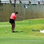 Armana Christianson hitting a one swing golf chip shot, because chipping is just a smaller version of your larger, full golf swing.