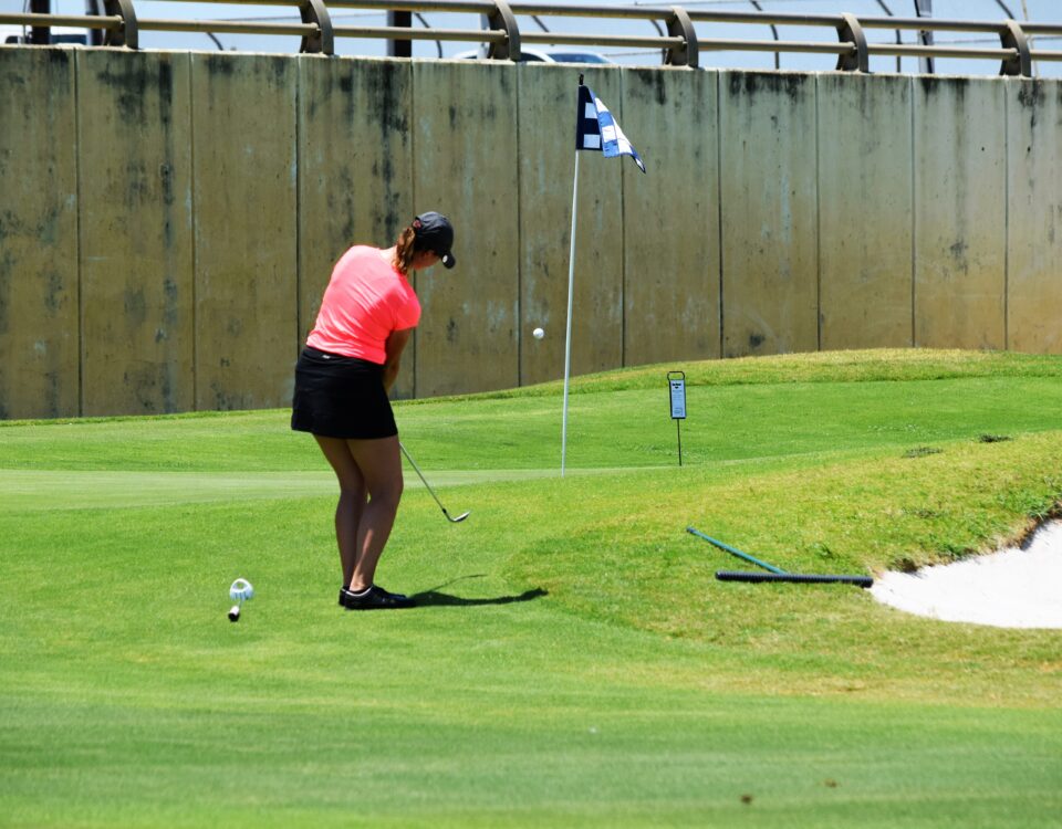 Armana Christianson hitting a one swing golf chip shot, because chipping is just a smaller version of your larger, full golf swing.